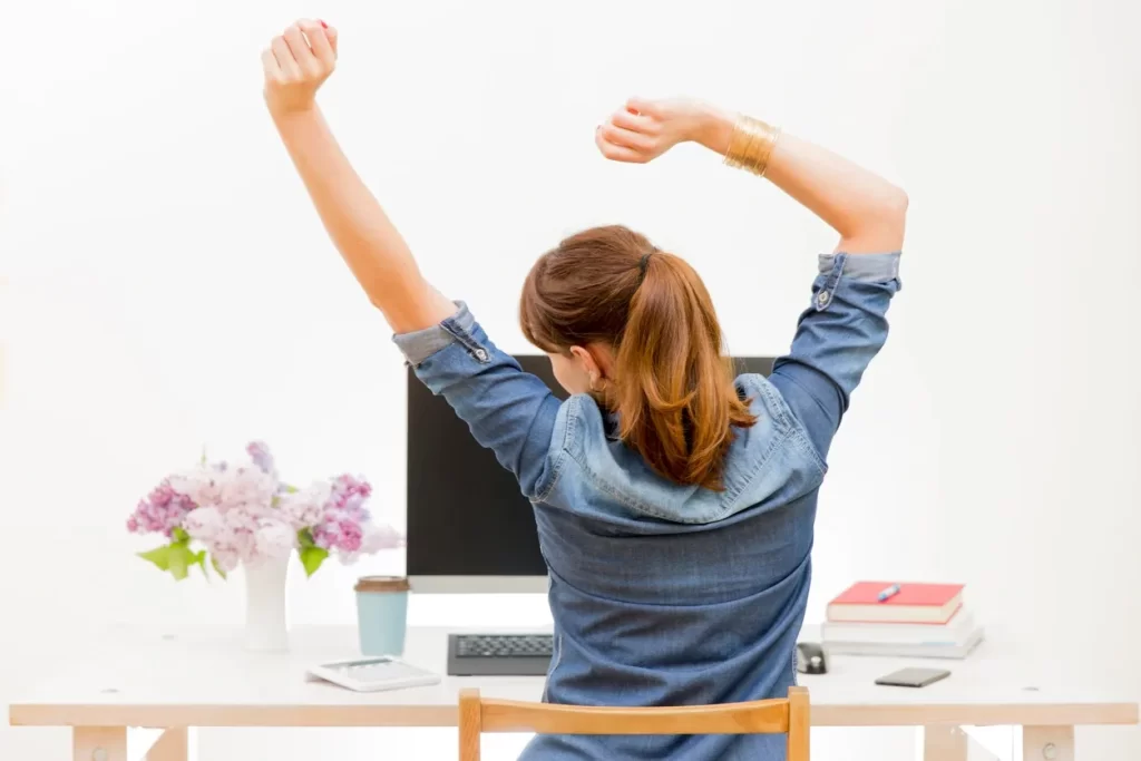 Woman enjoying work from home productivity tips to be pain-free